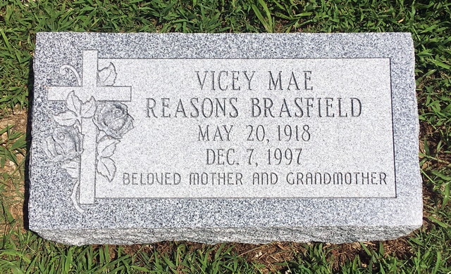 Brasfield Cross and Rose Carvings on Gray Granite