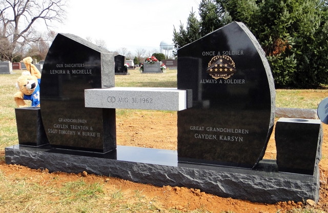 Black Monuments with Connecting Gray Bench